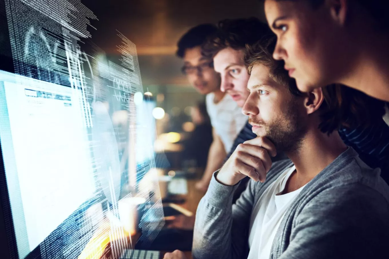 Team looking at computer